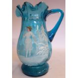In the manner of Mary Gregory - a turquoise glass jug of baluster form,