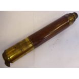 A late Victorian stitched hide clad and lacquered brass three section telescope with lens and