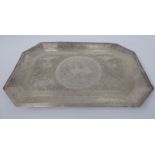 An Asian silver coloured metal tray of elongated octagonal form, having a wide,