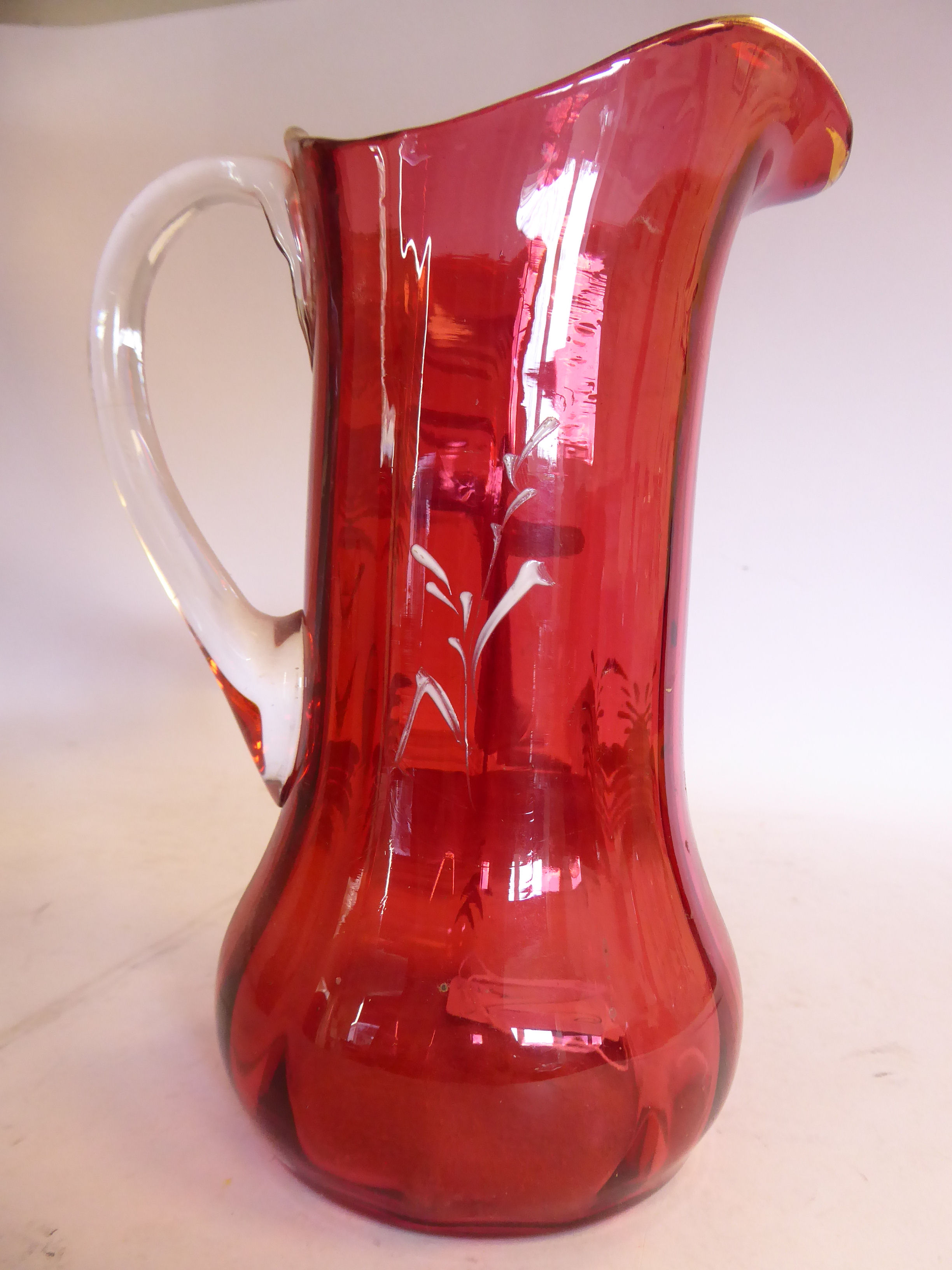 In the manner of Mary Gregory - a cranberry glass jug of waisted bulbous form, - Image 3 of 8