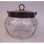 A late Victorian glass biscuit jar of panelled, bulbous form, having an applied silver collar,