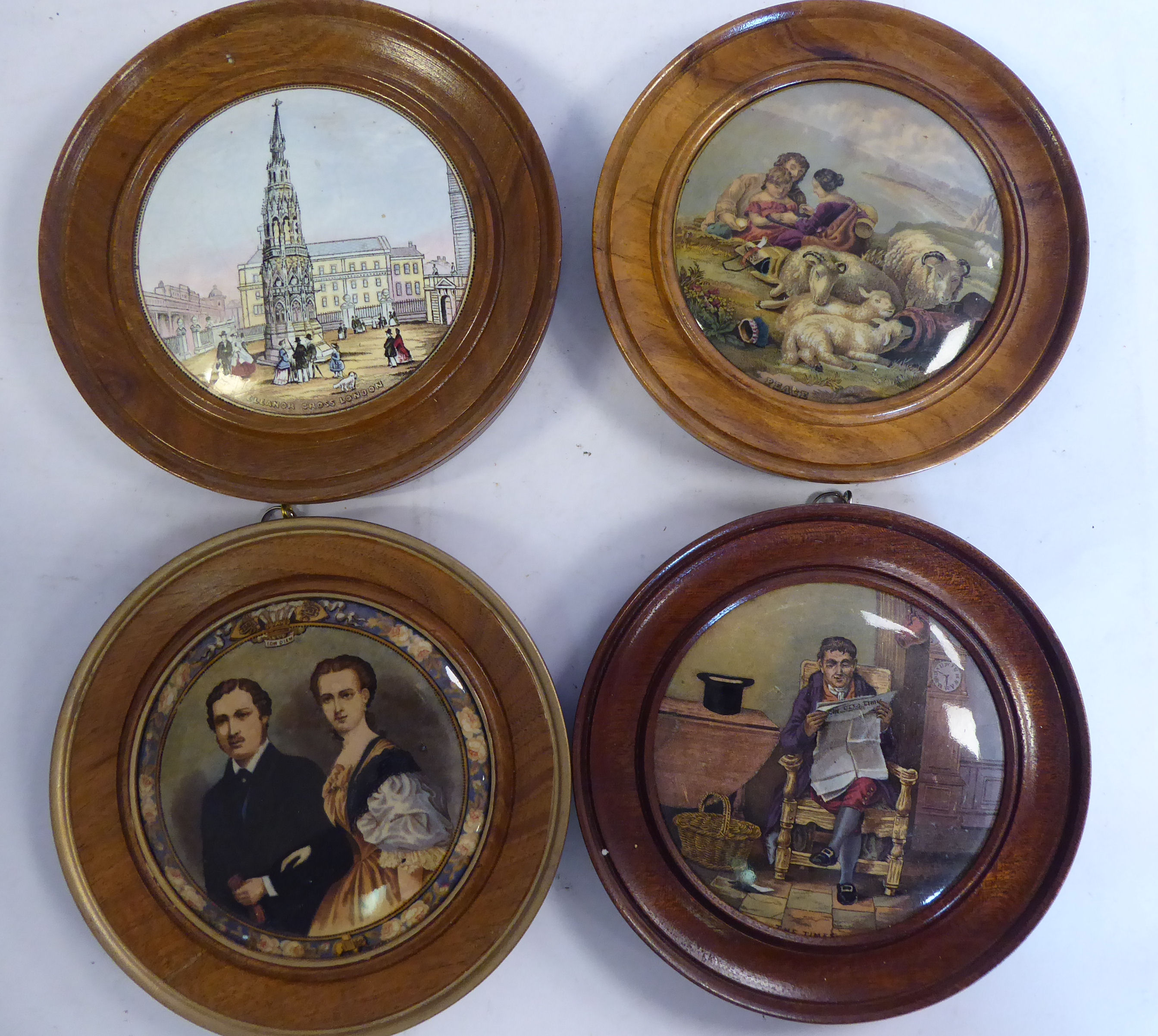 Four framed Prattware pot lids, respectively featuring 'The Times'; 'Peace'; 'Eleanor Gross,