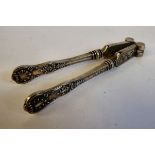 A pair of late Victorian nutcrackers on silver Queen's pattern handles JG Birmingham 1883