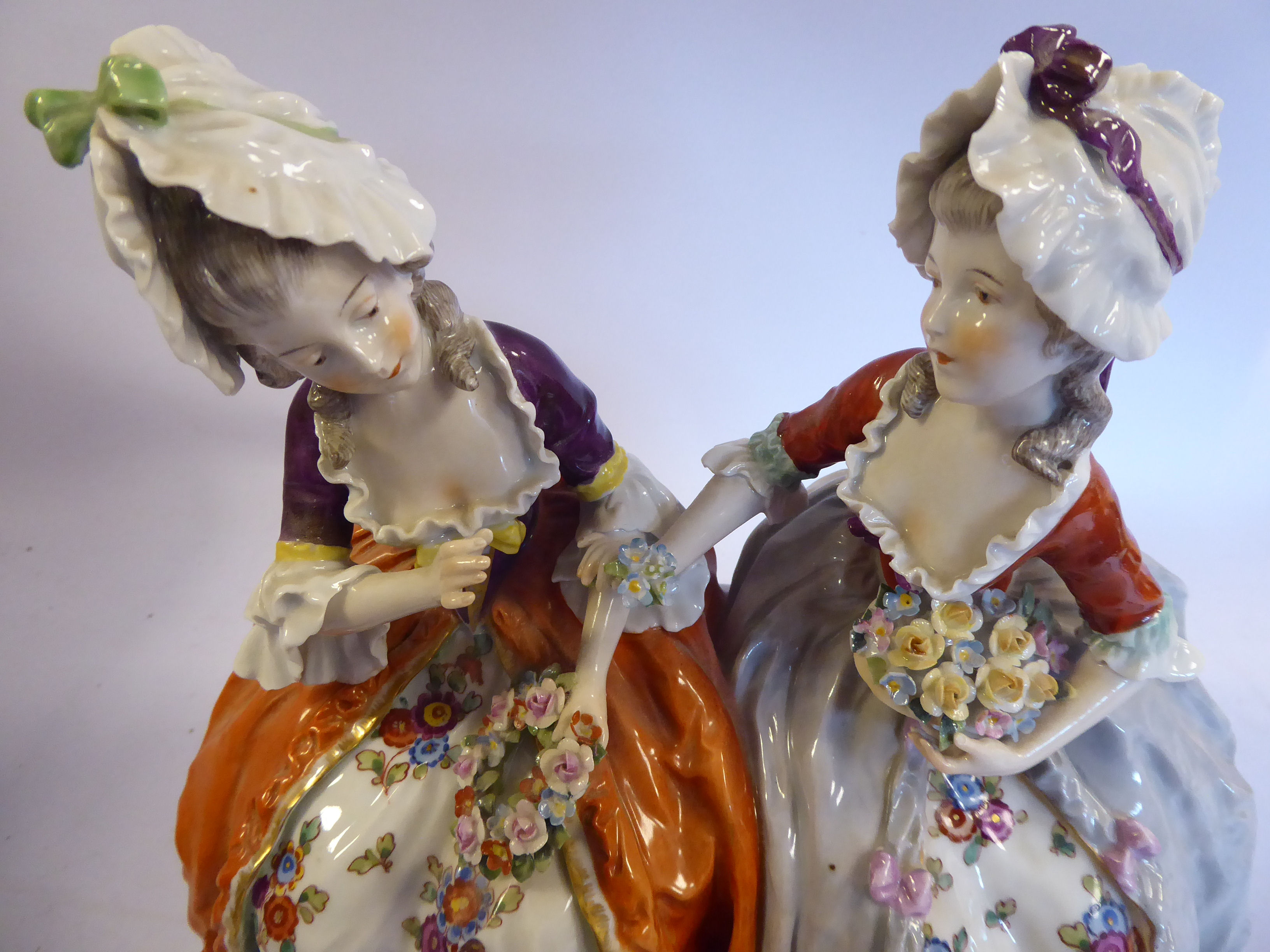 A 20thC Naples porcelain group, two seated young women wearing bonnets and floral skirts, - Image 3 of 10