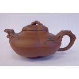 A 20thC Chinese Jiangsu province brown earthenware teapot of naturalistically moulded,