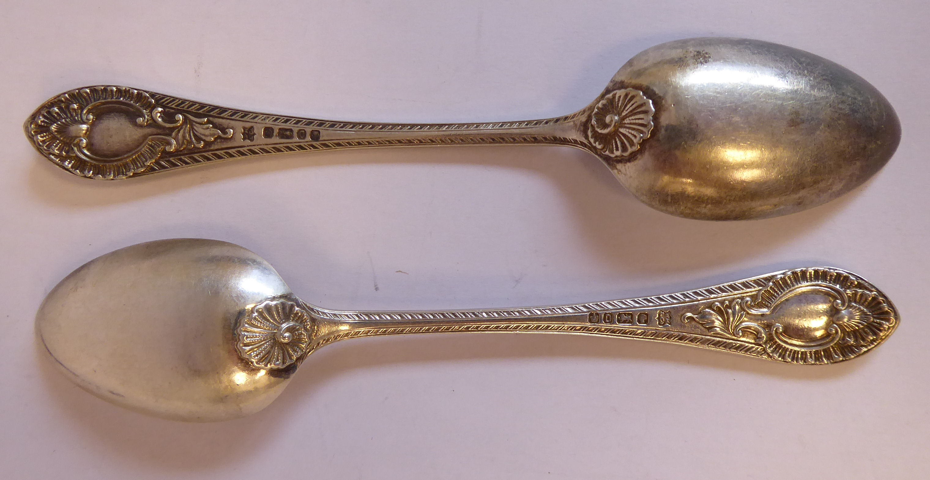 A set of twelve late Victorian silver fruit spoons, cast with shells, foliage, - Image 12 of 12