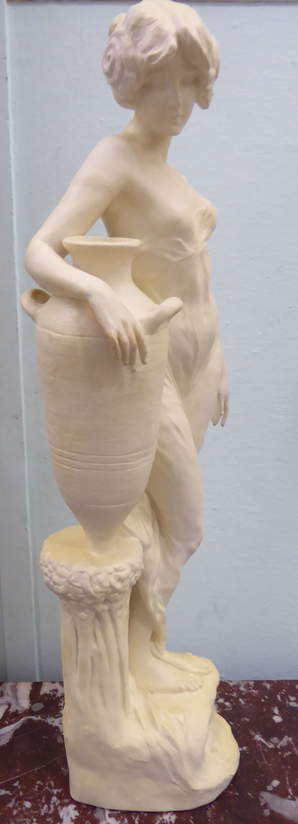 An unglazed standing plaster figure 'Aphrodite' holding a water vessel, - Image 3 of 16