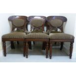 A set of six William IV mahogany framed dining chairs with curved, foliate scroll carved crests,