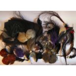 A collection of 'vintage' milliner's feathers and coloured net