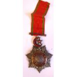 A Turkish Ottoman Empire Order of Medjidie Knight 5th Class medal, circa 1915 in enamelled red,