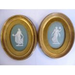 A pair of late 19thC Wedgwood sage green Jasper stoneware oval plaques,