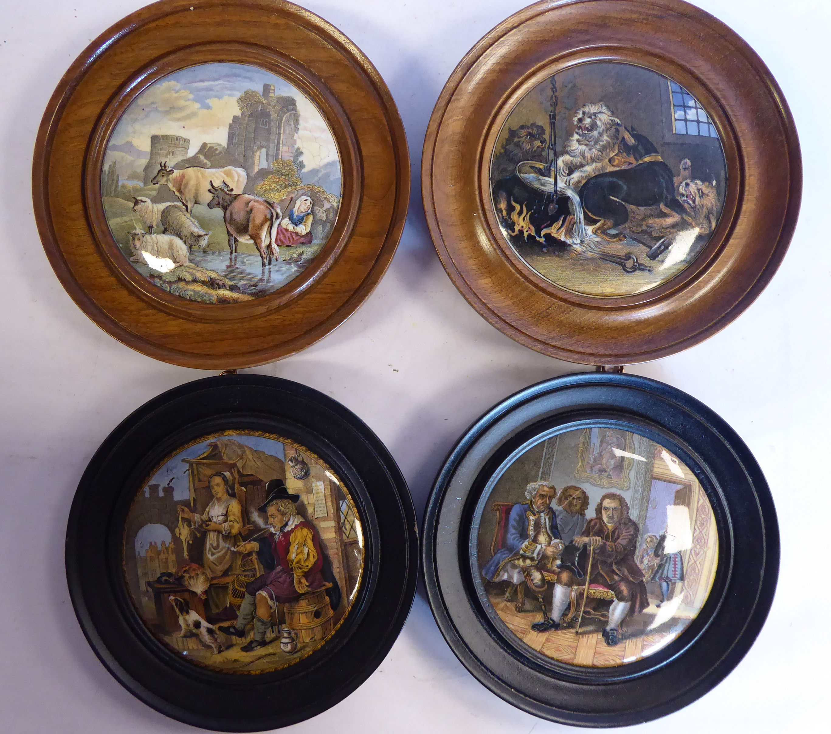 Four framed Prattware pot lids,