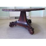 A William IV Colonial rosewood centre table, the figured tip-top with a wide scroll carved border,