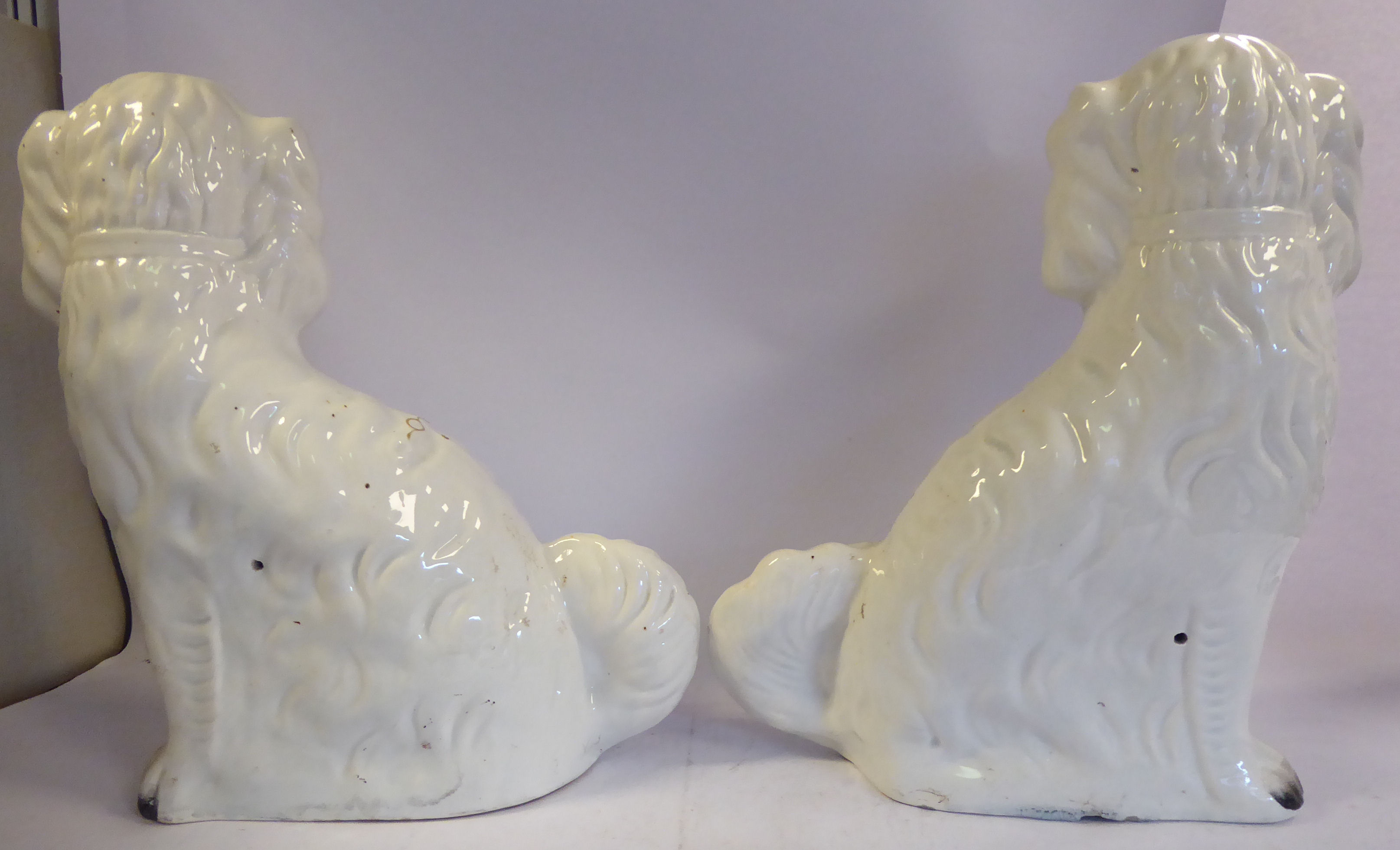 A pair of Staffordshire pottery ivory glazed, seated King Charles Spaniels with painted features, - Image 4 of 6