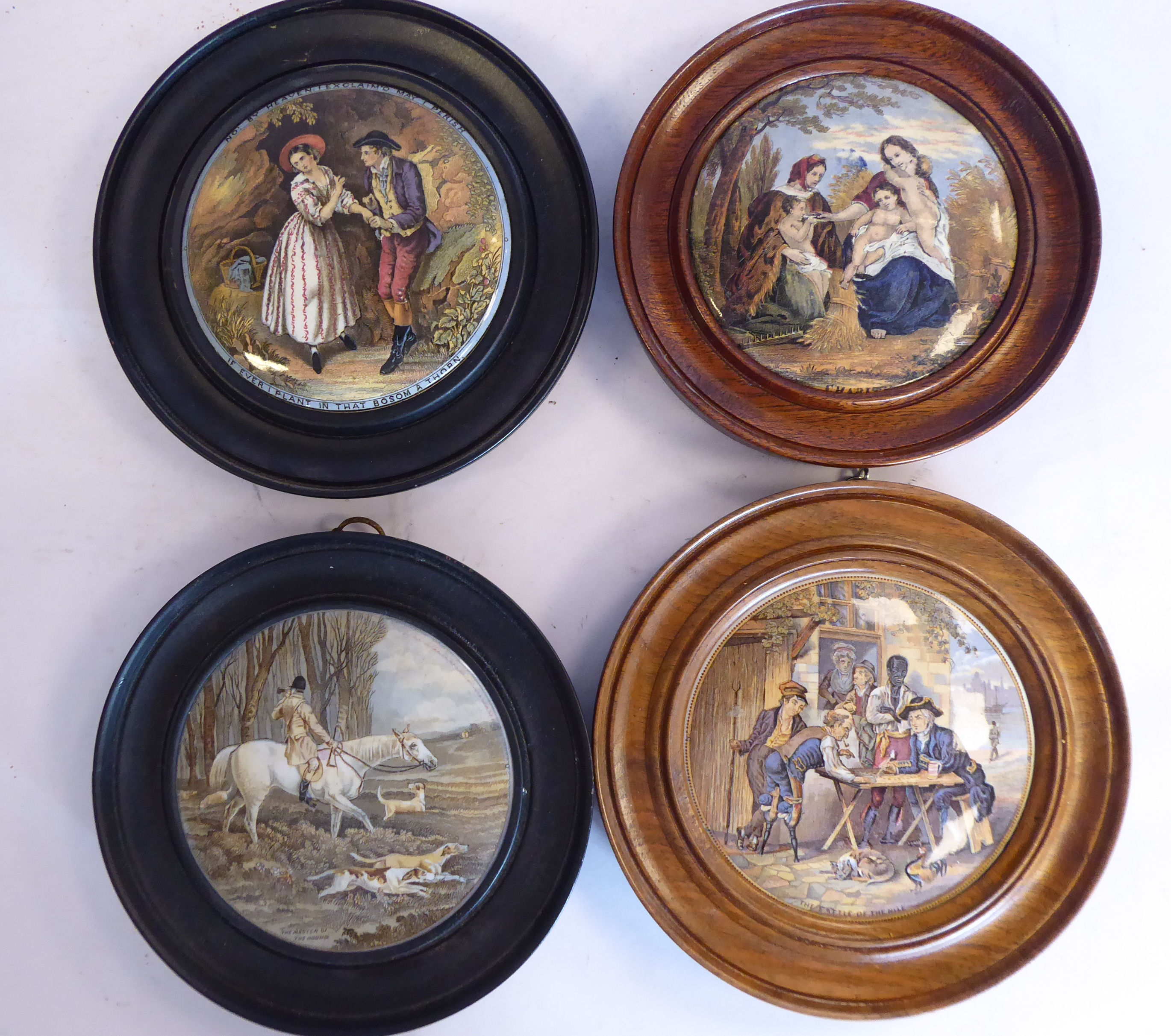 Four framed Prattware pot lids,