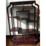 An early/mid 20thC Chinese rosewood freestanding, open,
