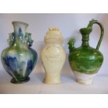 An 'antique' Chinese green glazed pottery ewer of tapered and shouldered baluster form with a high