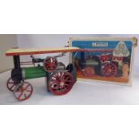 A Mamod live steam model traction engine, in green, red,