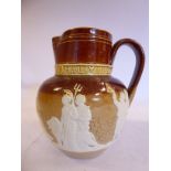 A Doulton Lambeth two tone brown salt glazed stoneware bulbous jug with a loop handle and wide neck,