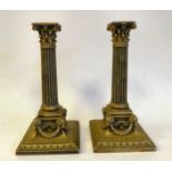A pair of late 19thC silver plated candlesticks, cast in neo-classical taste with detachable,