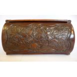 A late 19th/early 20thC Oriental stained and carved bamboo cylindrical box with a hinged lid bears