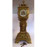 A late 19th early 20thC ornately cast brass cased tower timepiece,