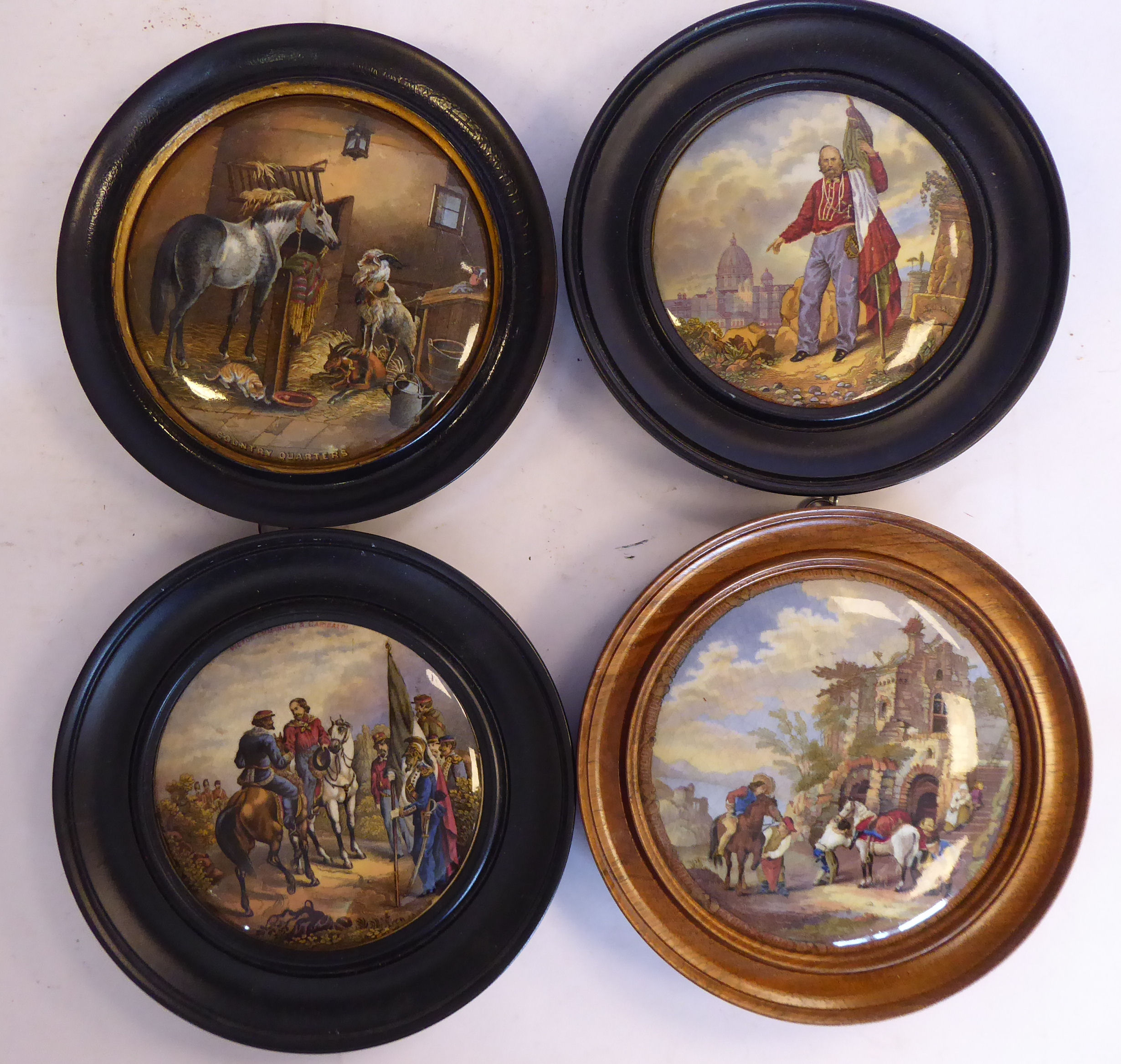 Four framed Prattware pot lids,