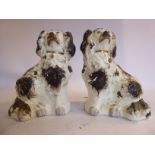 A pair of 19thC Staffordshire ivory glazed pottery models,
