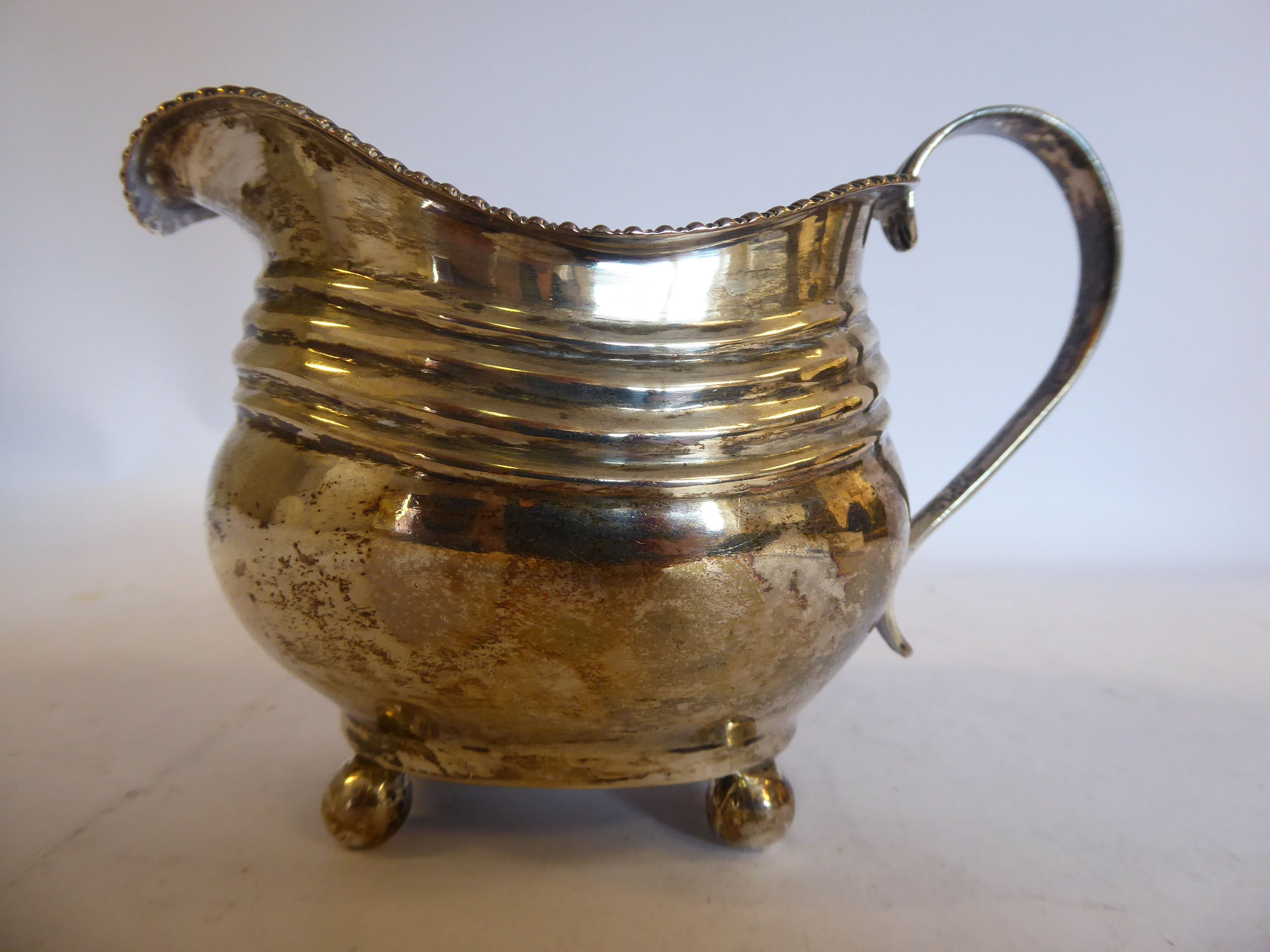 A George III silver cream jug of oval, - Image 3 of 6