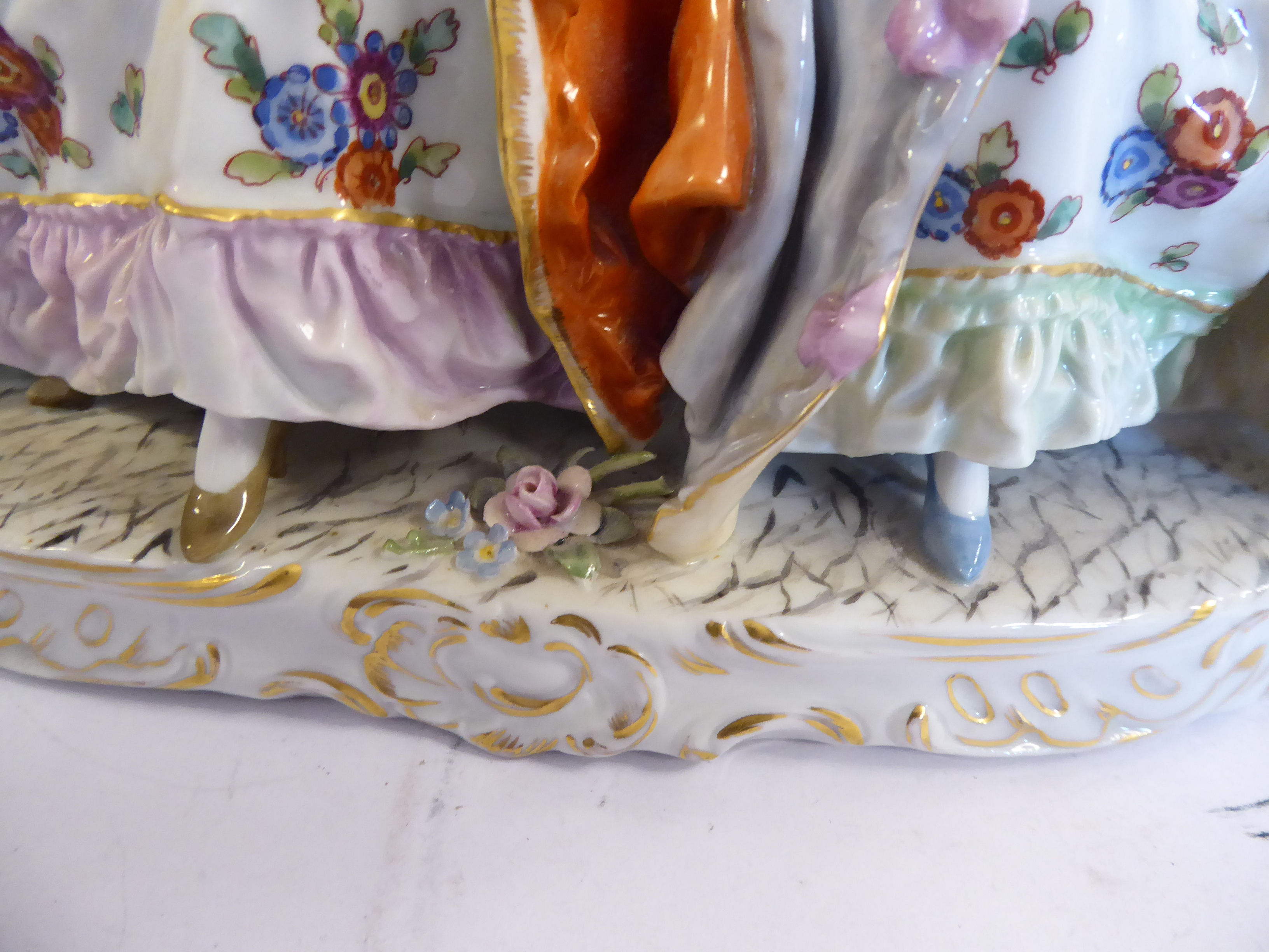 A 20thC Naples porcelain group, two seated young women wearing bonnets and floral skirts, - Image 5 of 10