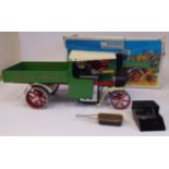 A Mamod live steam model wagon, in green, red,