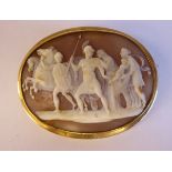 An oval shell carved cameo brooch, featuring Roman characters, women and children,