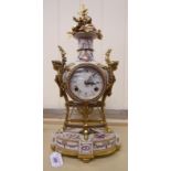 A modern V & A production of the Marie Antoinette clock in a floral decorated and gilded metal