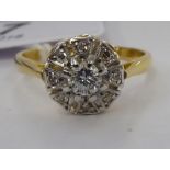 An 18ct gold diamond cluster ring 11