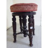 A late Victorian mahogany framed music stool,