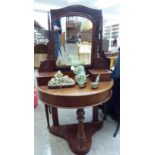 An Edwardian Duchess style semi-circular, mahogany dressing table, surmounted by a mirror,