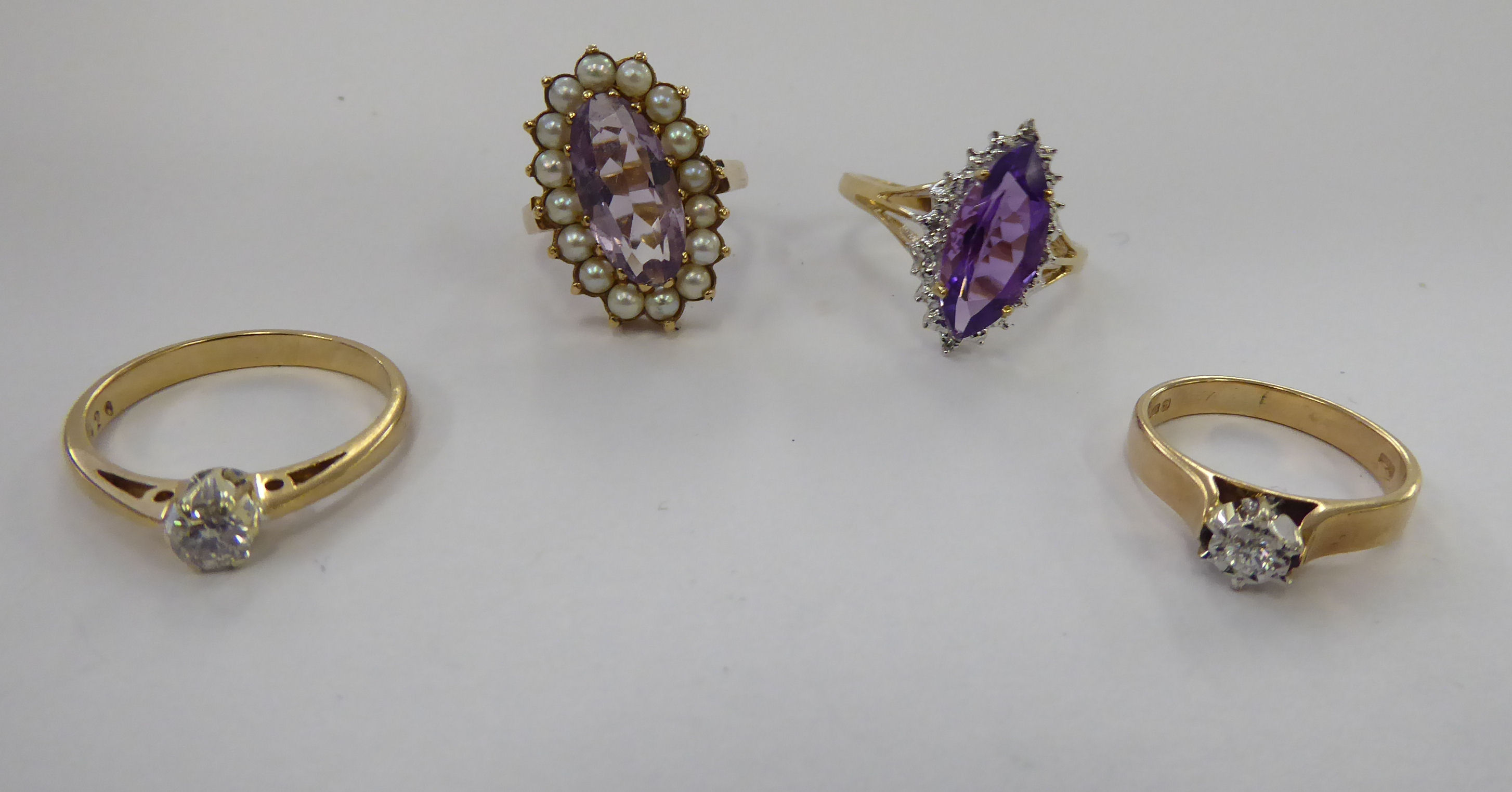 Four 9ct gold rings,