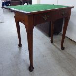 A George III mahogany card table, the foldover top above a frieze drawer, raised on turned,