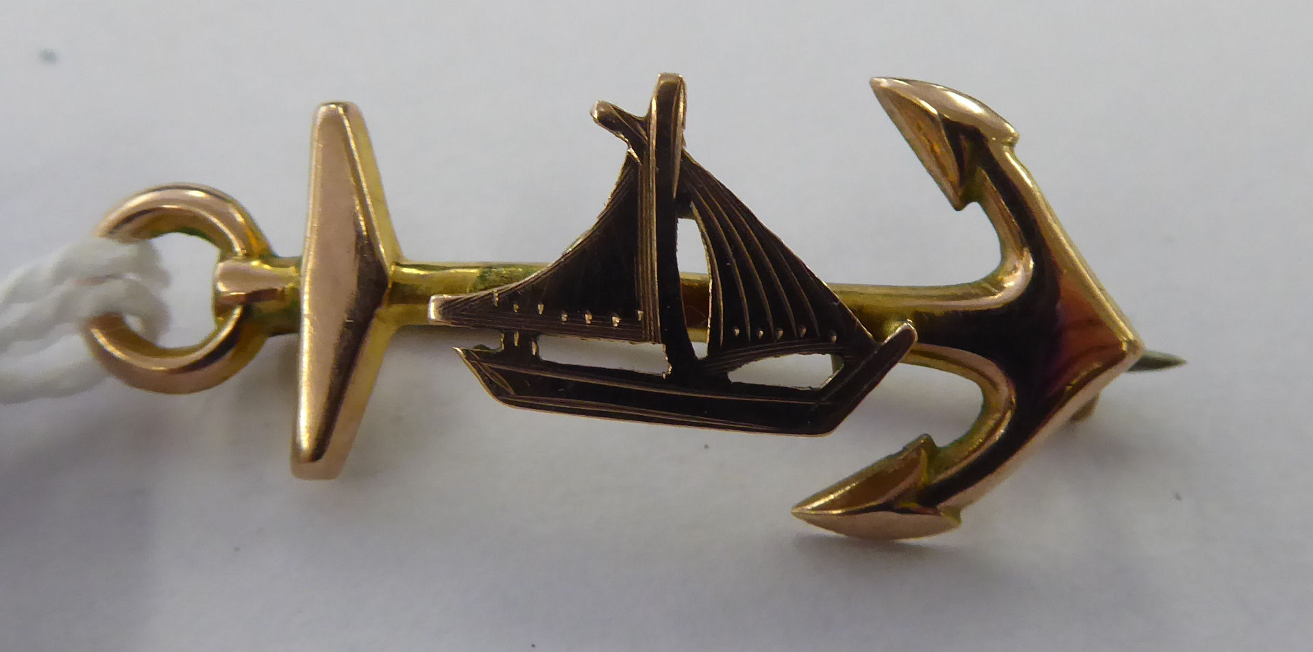 A 9ct gold 'anchor and ship' bar brooch 11