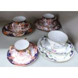 Three dissimilar Royal Crown Derby bone china trios; and a miniature,