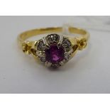An 'antique' 18ct gold ruby and diamond set cluster ring 11