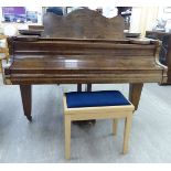 A 'vintage' figured walnut cased boudoir grand piano, raised on square,