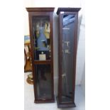 Two associated oak cased synchronised 'slave' clocks 56''h with various accessories BSR