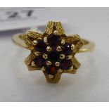 A 9ct gold and garnet set cluster ring 11