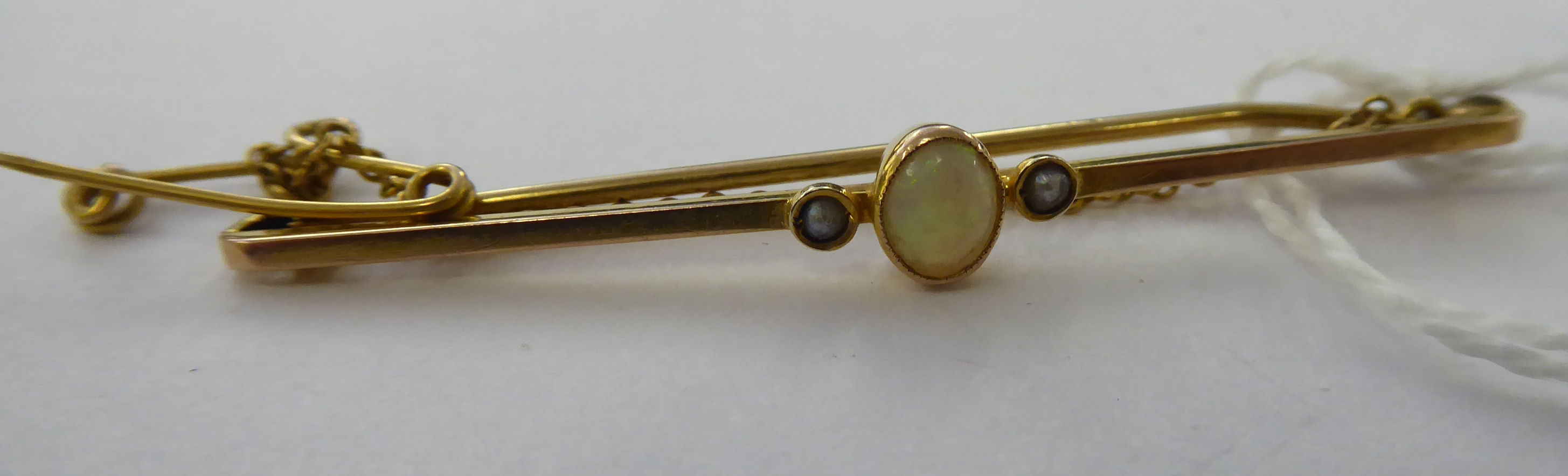 An 'antique' 9ct gold opal set bar brooch 11