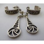 Two dissimilar pairs of silver earrings 11