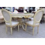 A modern Continental carved, gilded and painted dining table with a plate glass top,