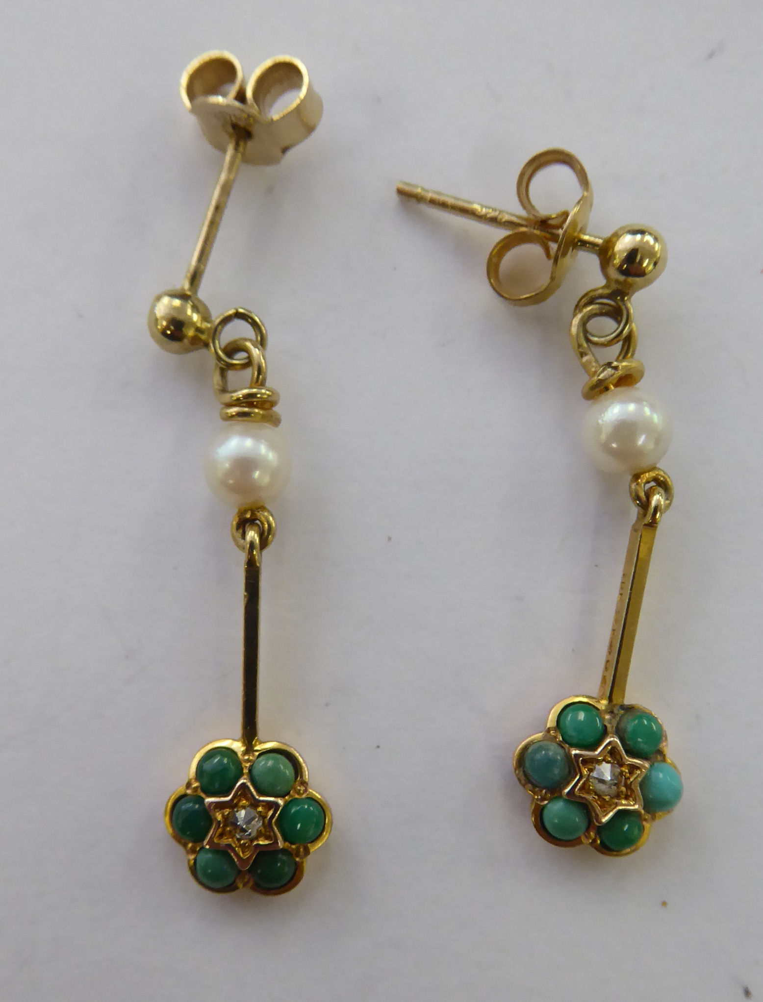 A pair of 9ct gold pearl and turquoise rosette drop earrings 11