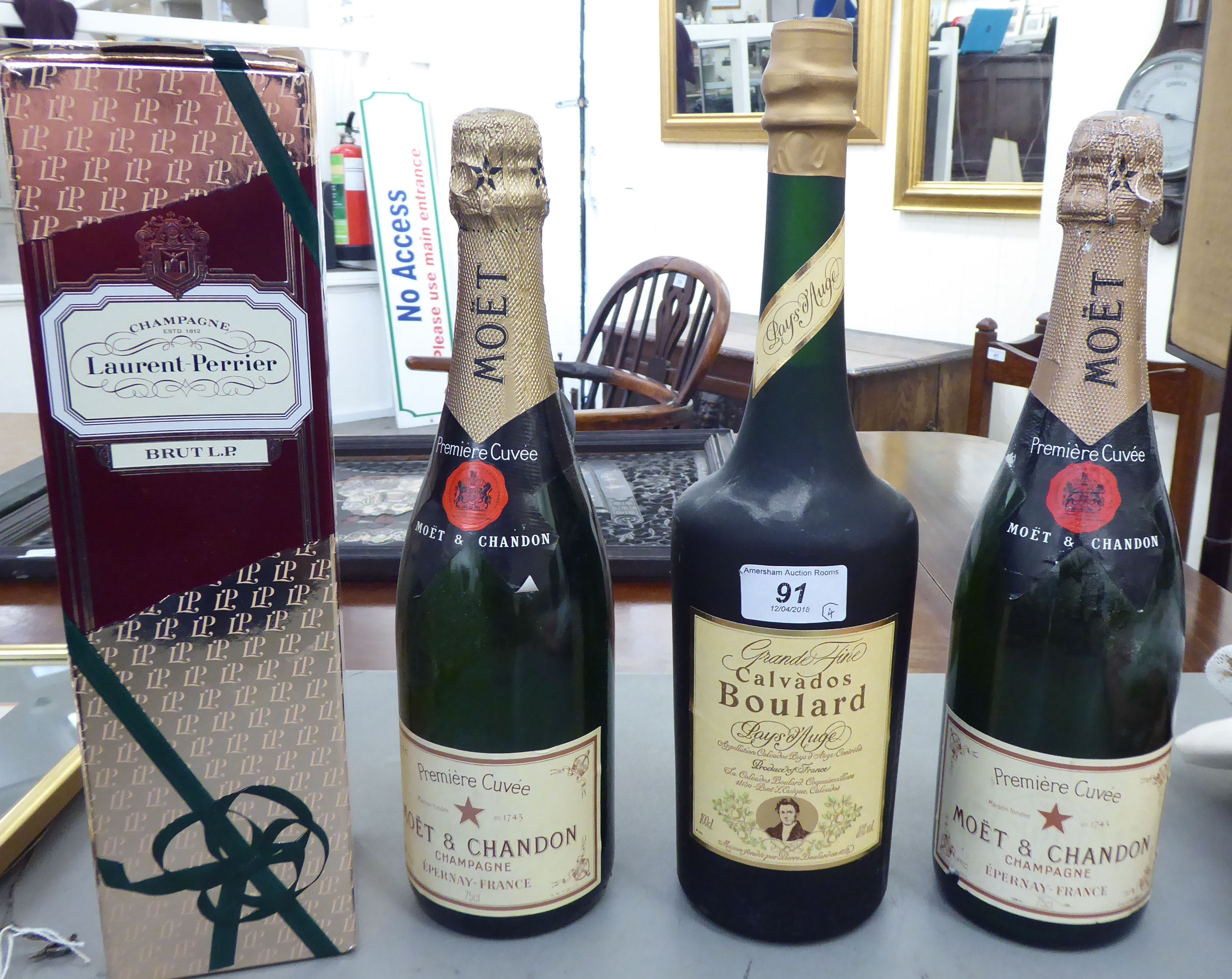 A 100cl bottle of Grande Fine Calvados Boulard; two bottles of Moet & Chandon;