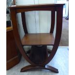 A modern mahogany finished lamp table with an inset, clear bevelled mirror panel,